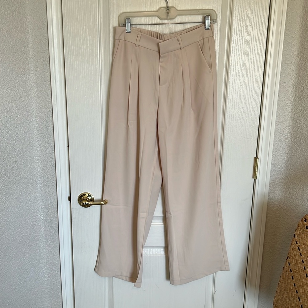 Trousers (wide leg) never worn! Tag is L but fits like a M.
